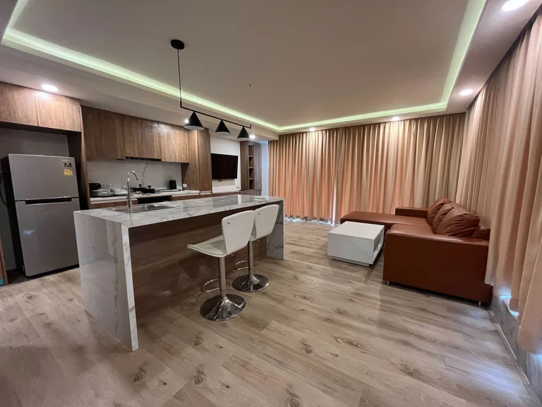 Open-plan kitchen and living room at Ocean Town Kata