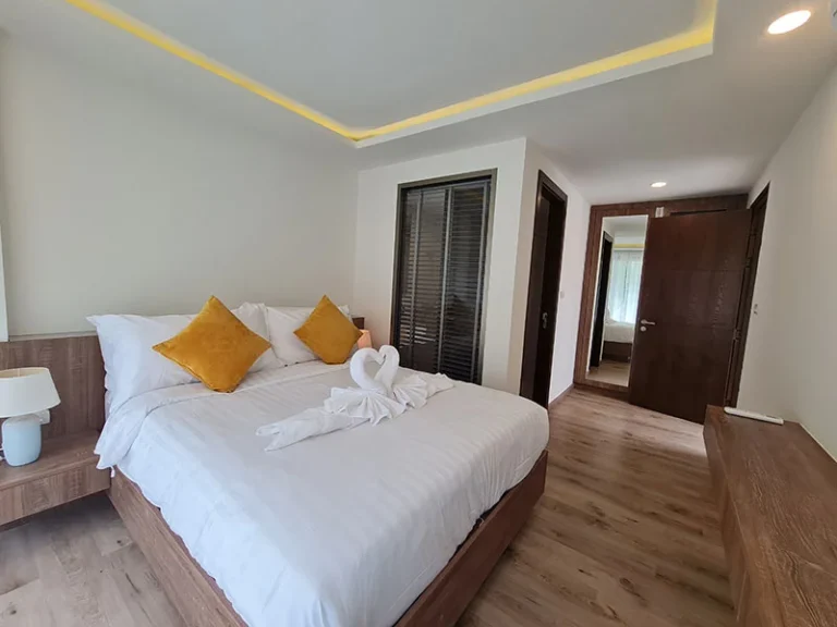 Bedroom at Ocean Town Kata with a double bed