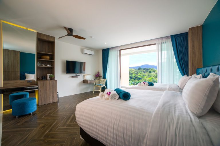 Guest room at Oceana Resort with a double bed and a hill view