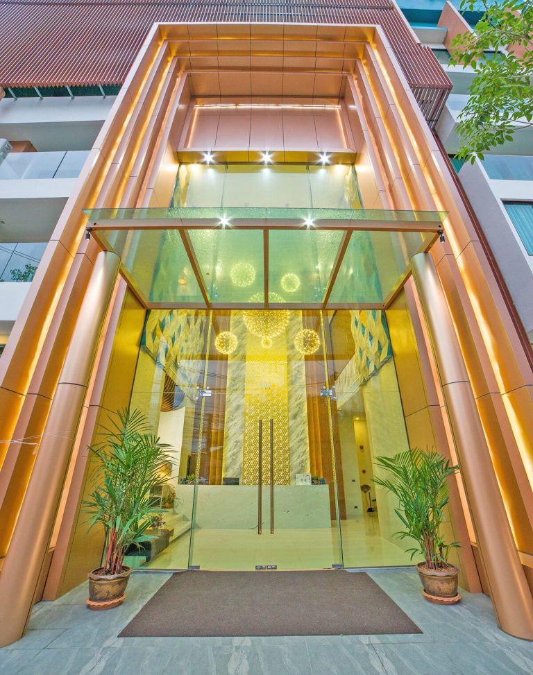 Entrance of Oceana Resort under a glass canopy